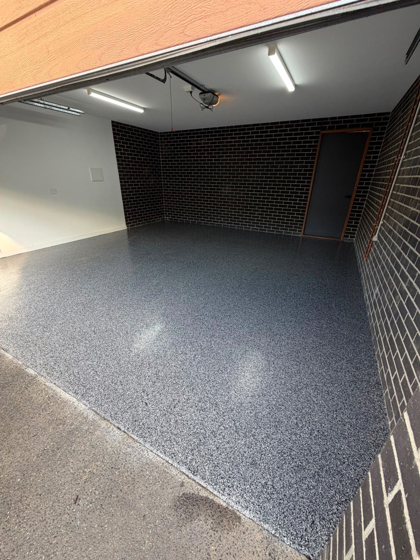 dark grey flake epoxy garage floor installed in Whitchurch-Stouffville