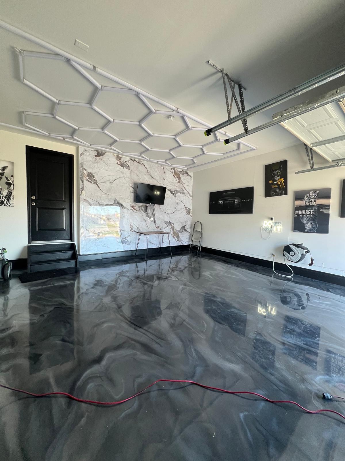 Reflective black and silver metallic epoxy garage floor installed by Buildwell Flooring Solutions
